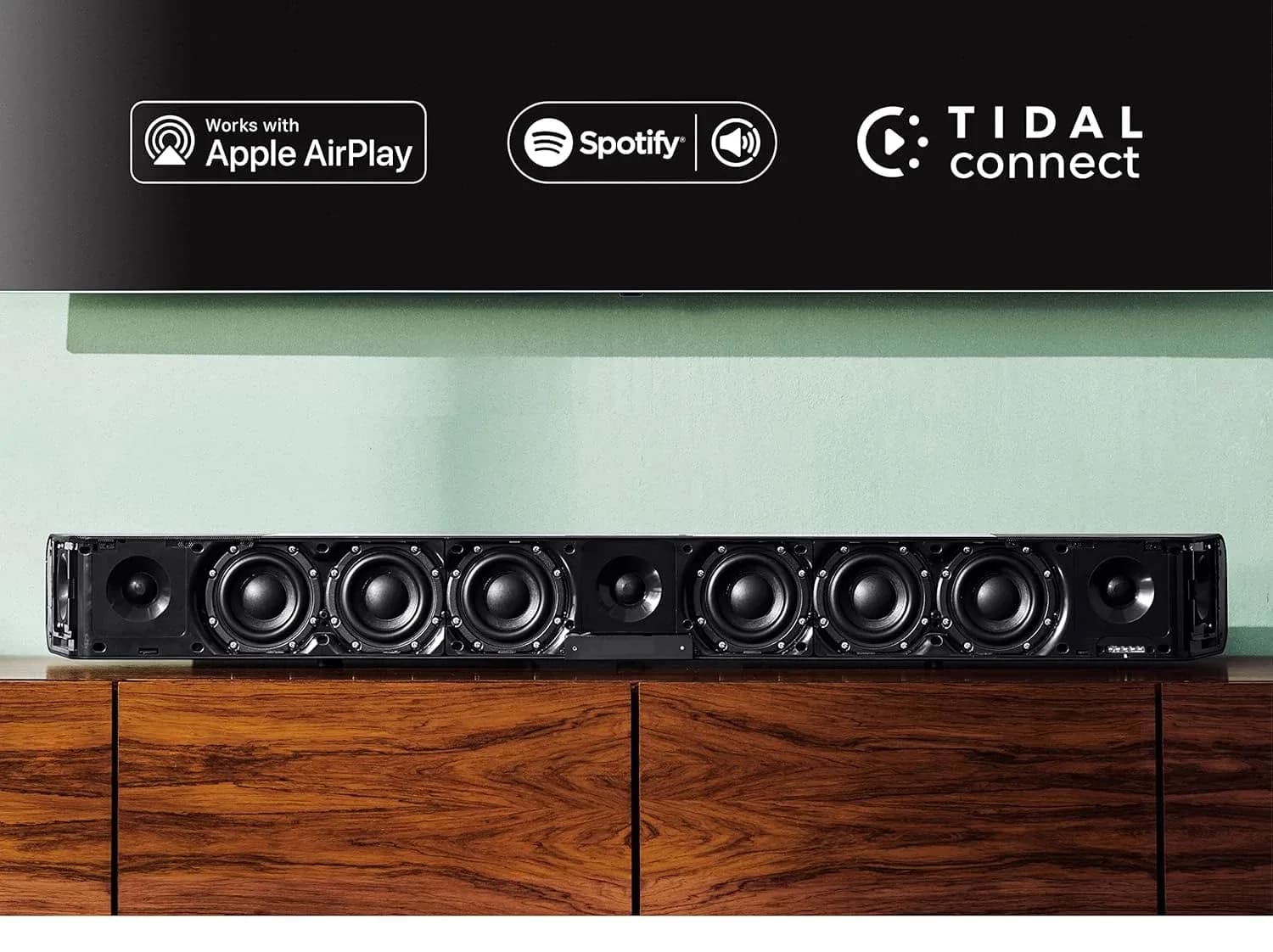 The AMBEO Soundbar Max with its grille removed, showing the full driver array