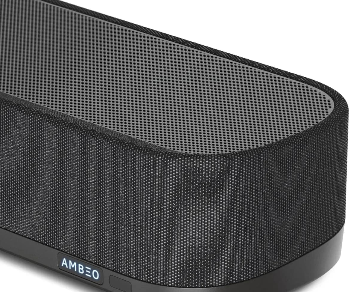 Close view of the acoustic fabric wrap and the AMBEO badge