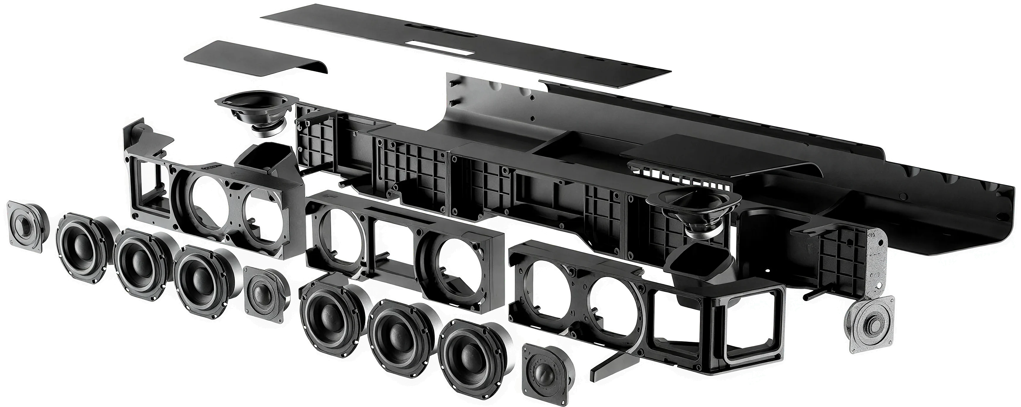 Official Sennheiser exploded view of the AMBEO Soundbar Max, showing the top panels, up-firing drivers, six woofers, five tweeters, driver baskets, chassis and side-firing end caps laid out in sequence